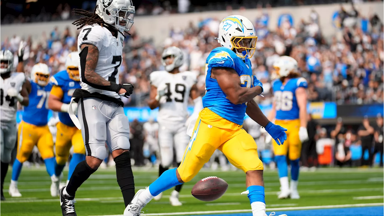 Dobbins rushes for 135 yards as Chargers beat Raiders in Harbaugh's debut