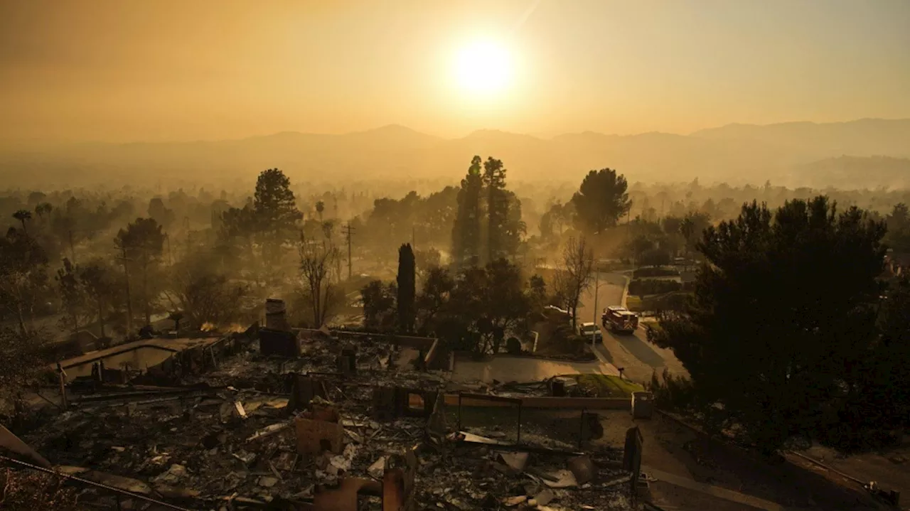 Fires devastating Los Angeles grow more slowly as fierce winds die down