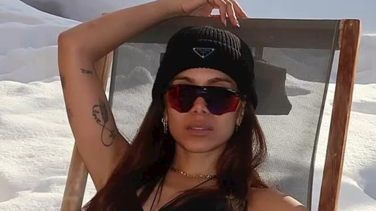 Anitta poses up in a bra and underwear in the snow during Switzerland trip