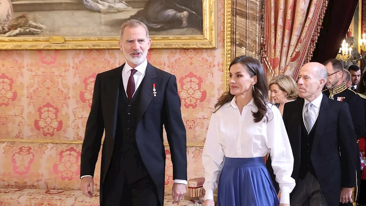 Queen Letizia of Spain oozes sophistication in blue satin skirt as she joins King Felipe for...