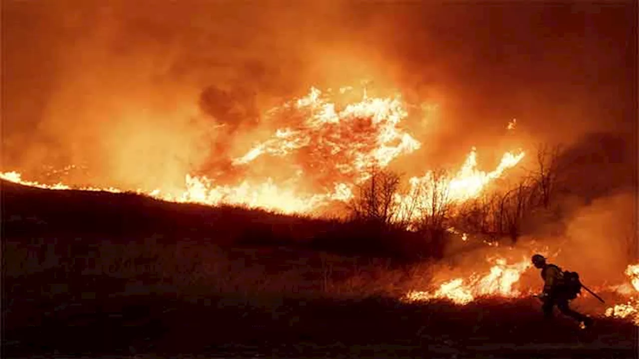 LA area's 2 biggest blazes burn at least 10,000 structures, while new fire leads to more evacuations