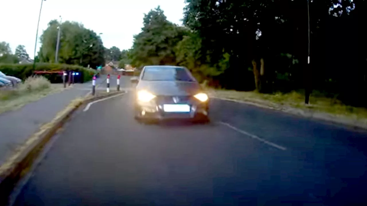 Man jailed after ramming stolen car into police motorcyclist in collision caught on camera