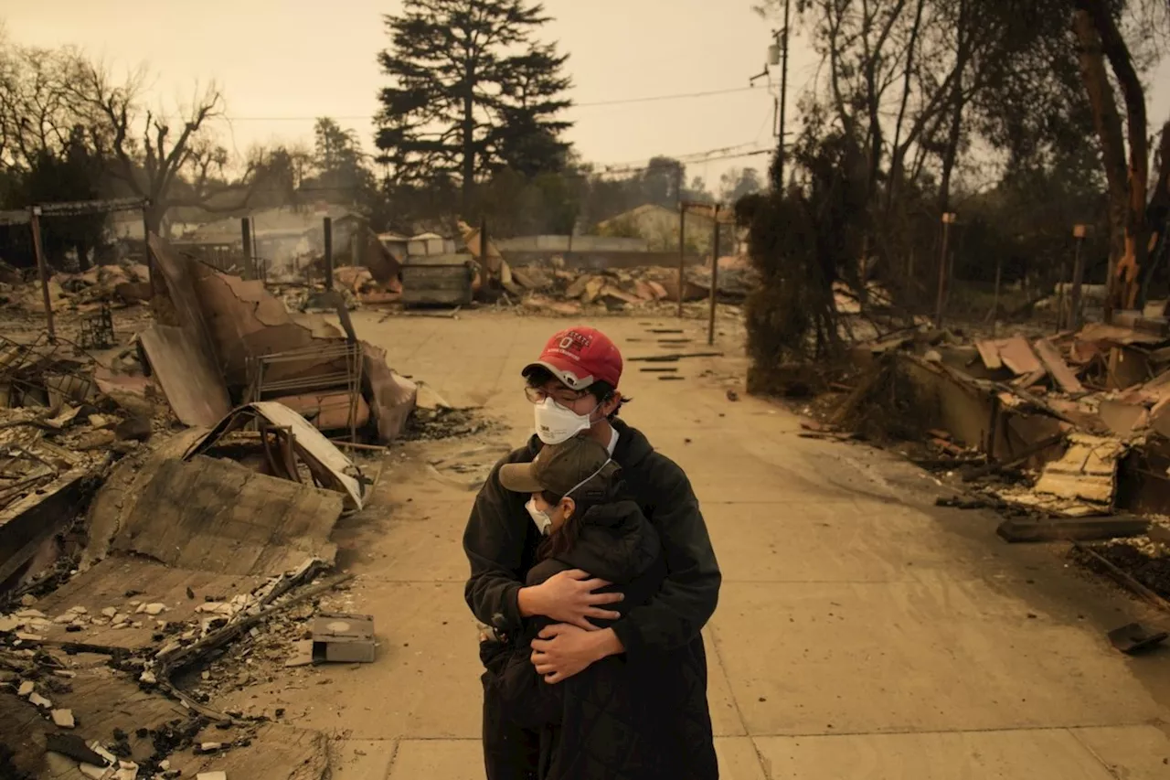 Firefighters hope for a break from fierce winds fueling devastating blazes in Los Angeles area