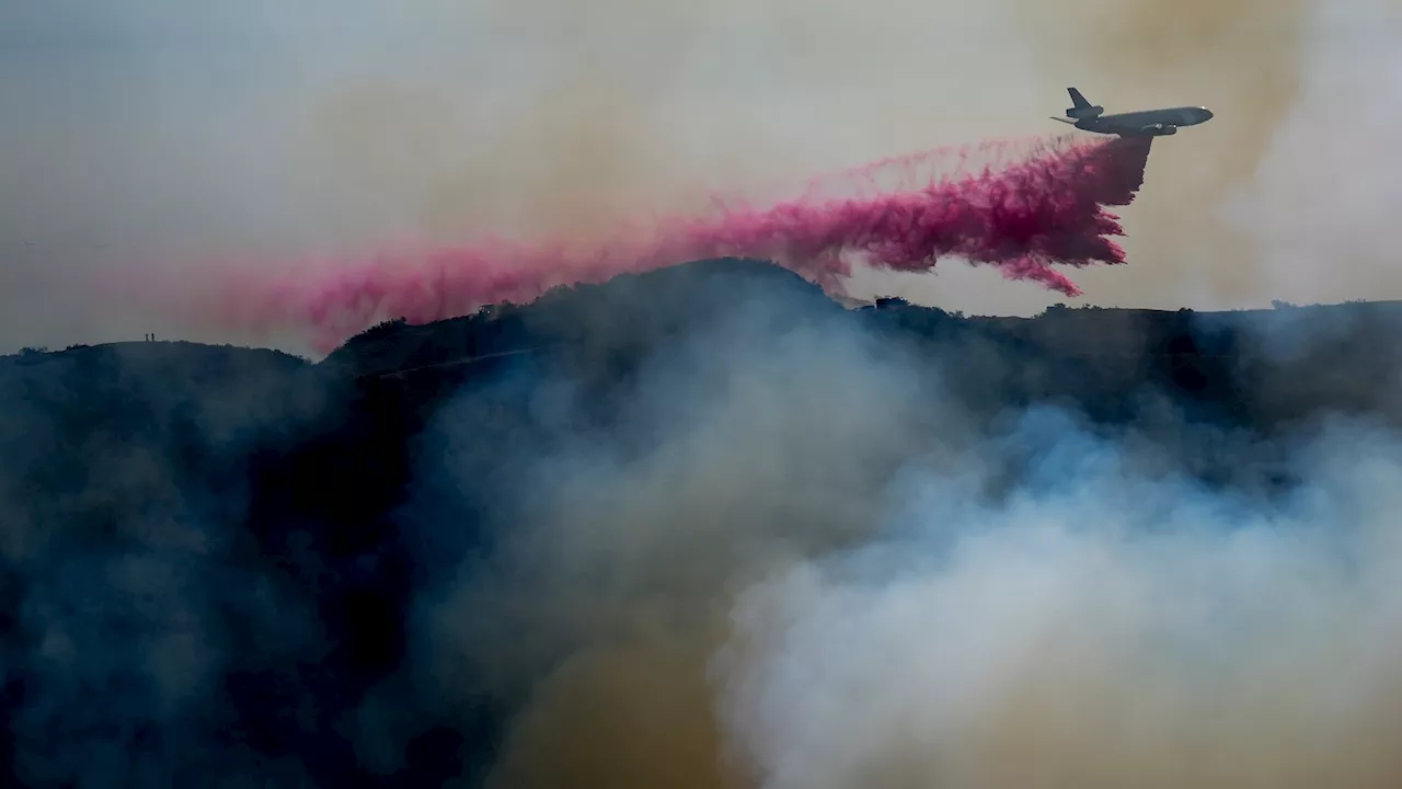 Fire officials plead for people to not fly drones over wildfire-ravaged areas of Southern California