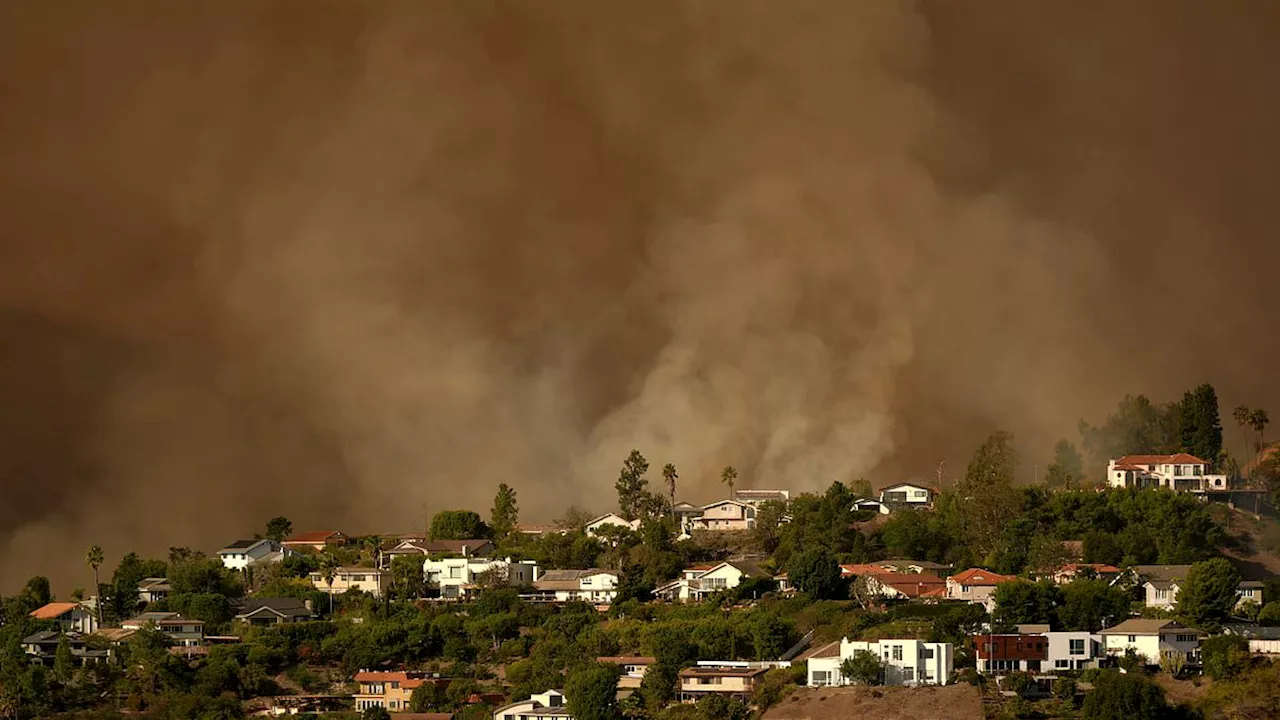 California Wildfires Rage On, Fueled by High Winds and Potential Power Line Fault