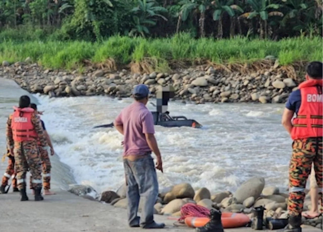 Bomba rescue man stranded on truck roof after vehicle swept away by river currents in Kota Marudu