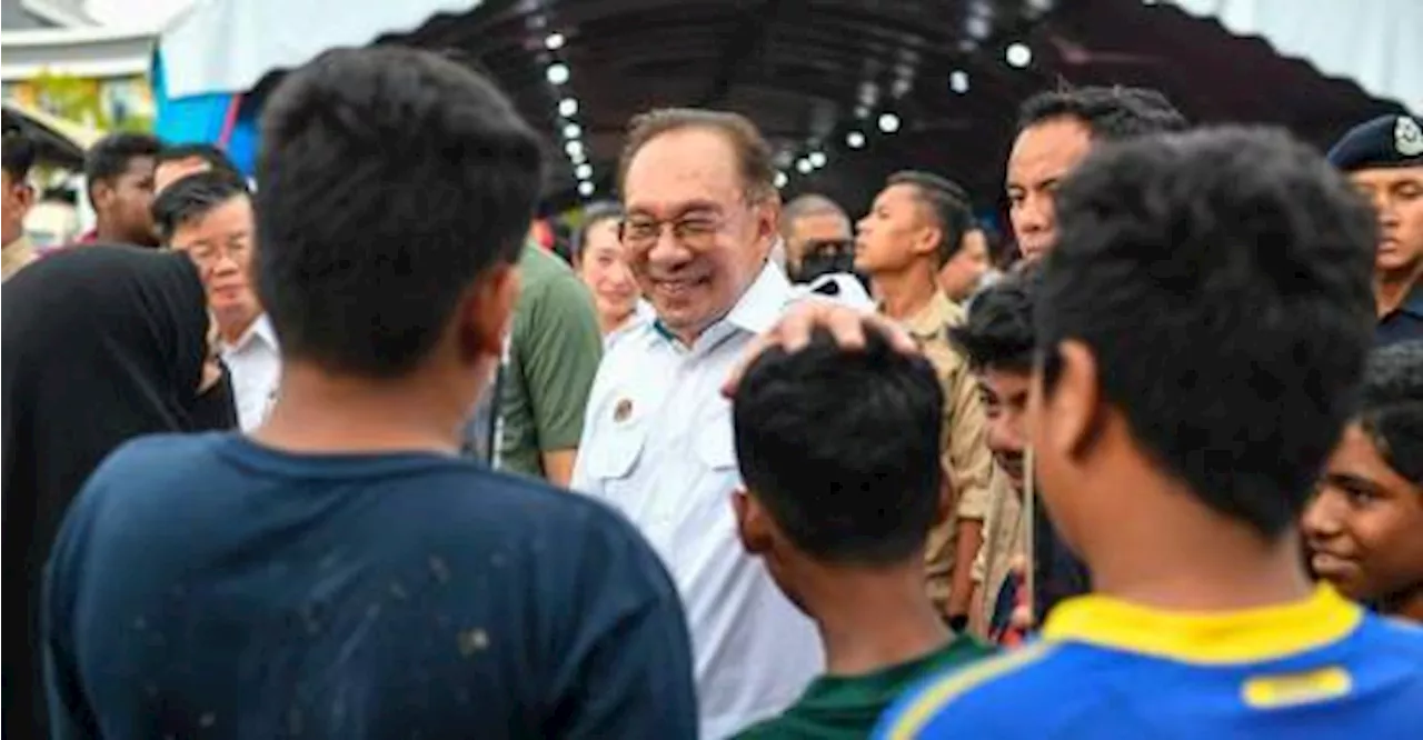 PM Anwar hands over essentials, school supplies