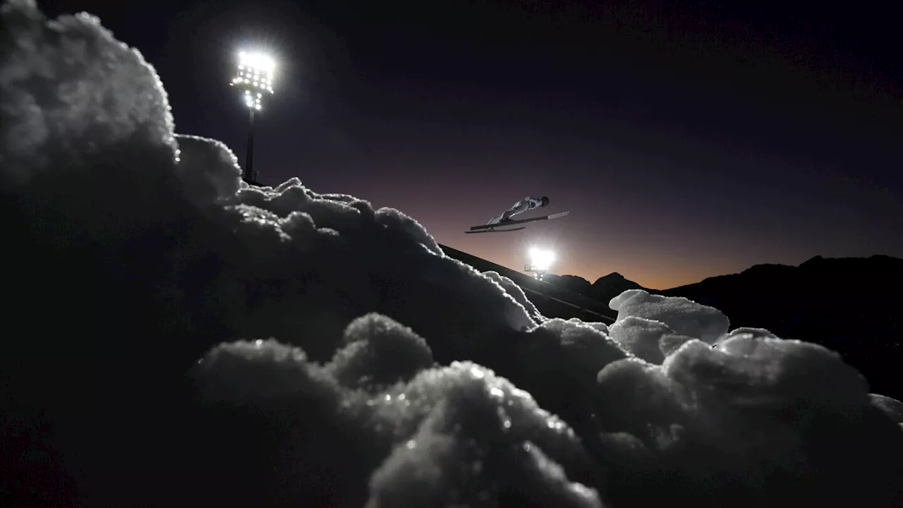 Photographer Captures Stunning Image of Ski Jumper Soaring Above Clouds