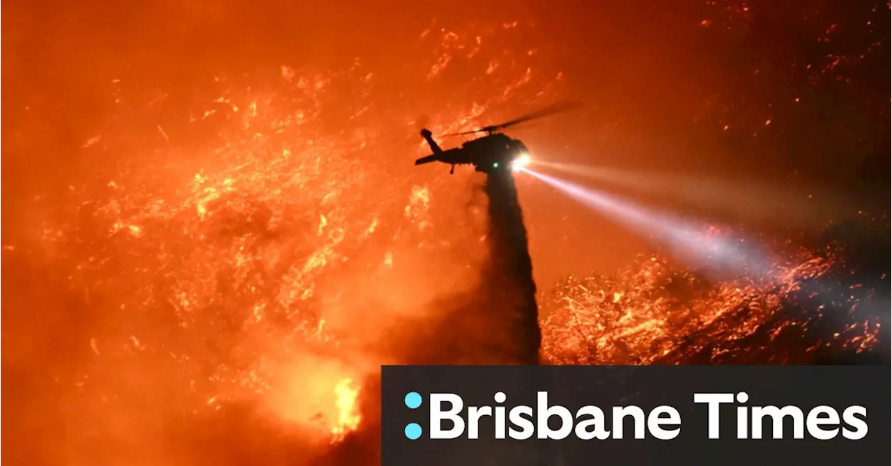 Firefighters scramble to contain Los Angeles fires ahead of high winds