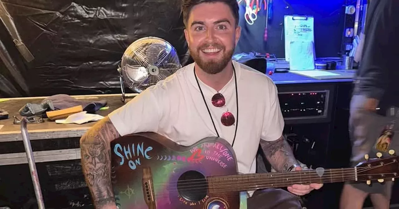 Airdrie singer's 'pinch me moment' after getting pic with Chris Martin's guitar before Coldplay gig