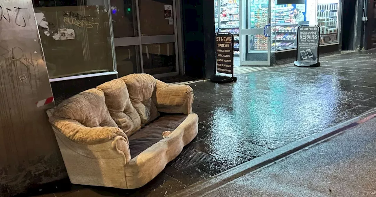 Stunned Sauchiehall Street revellers watch on as brazen pair dump couch near nightclub