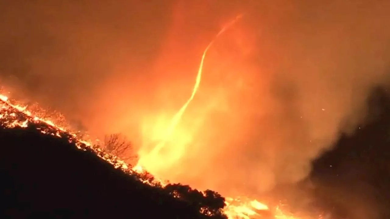 Watch terrifying moment FIRENADOS rage through LA hills as firefighters face crucial 48hr window to...