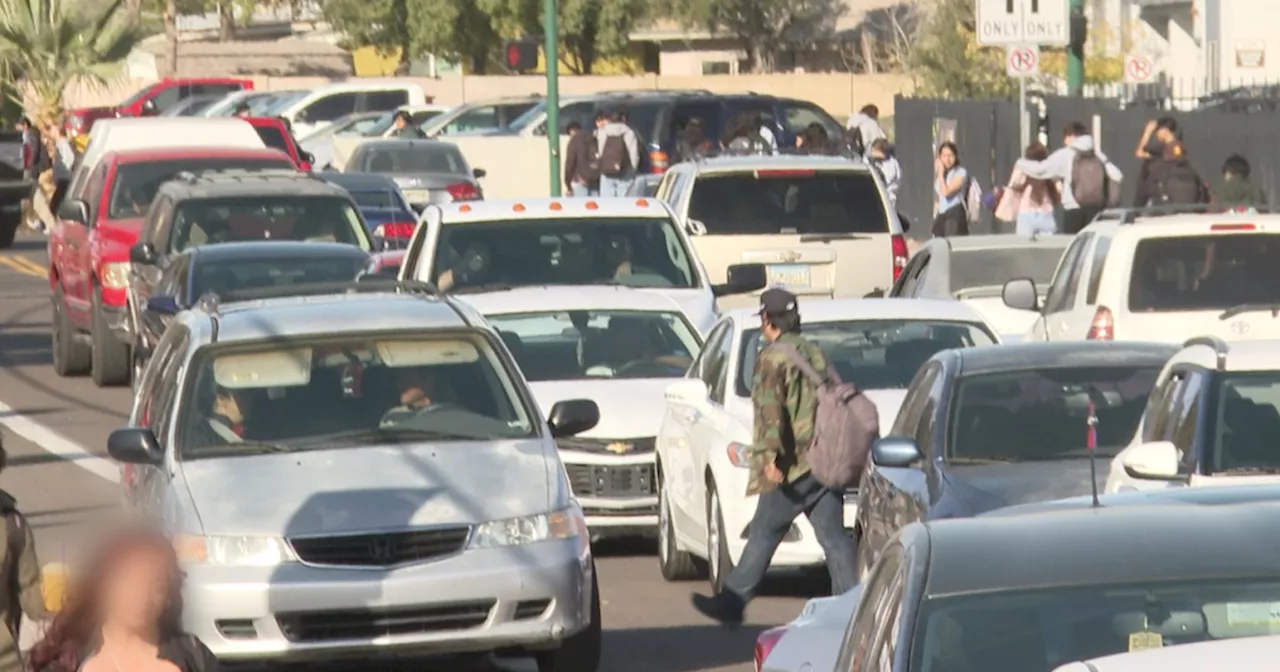 Cars ignore parking rules, students jaywalk during chaotic Washington High School pick-up time