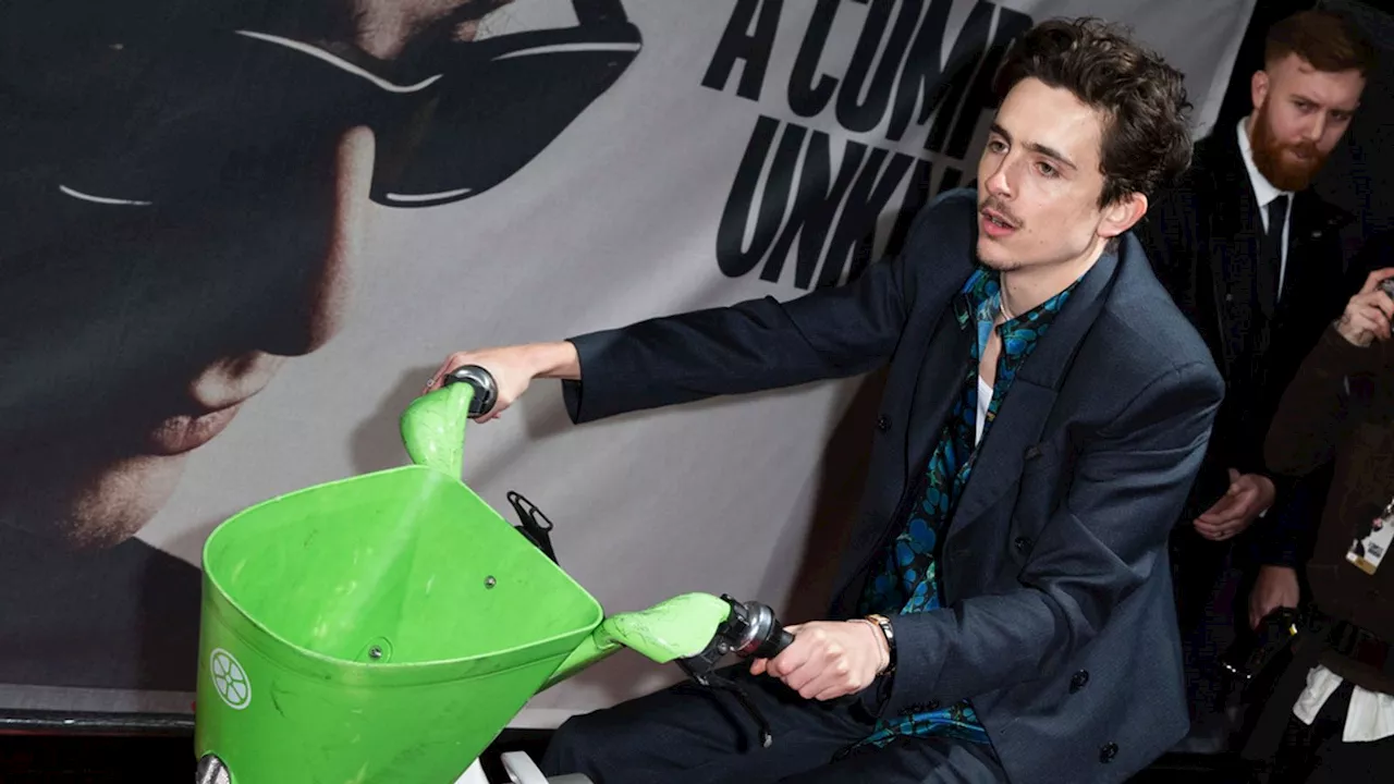 Timothee Chalamet Arrives at Bob Dylan Biopic Premiere on a Lime Bike