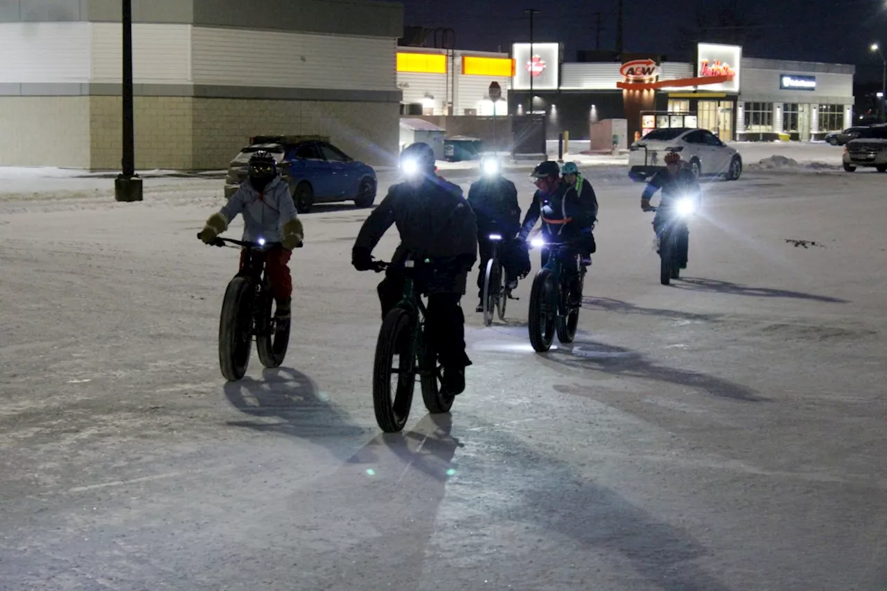 Cyclists brave elements to promote bike lanes