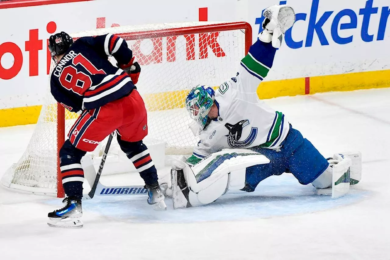 Connor's Hat Trick Powers Jets to 6-1 Victory Over Canucks