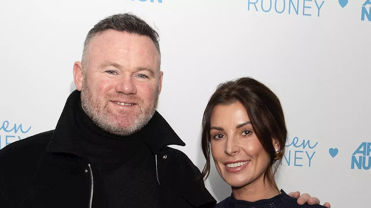 Coleen Rooney is supported by husband Wayne while attending the launch of her new wellness range -...