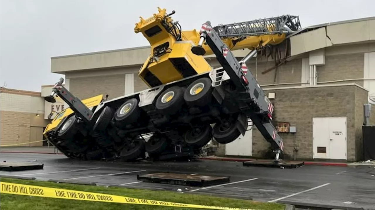 2 people injured after crane falls into Everett Mall