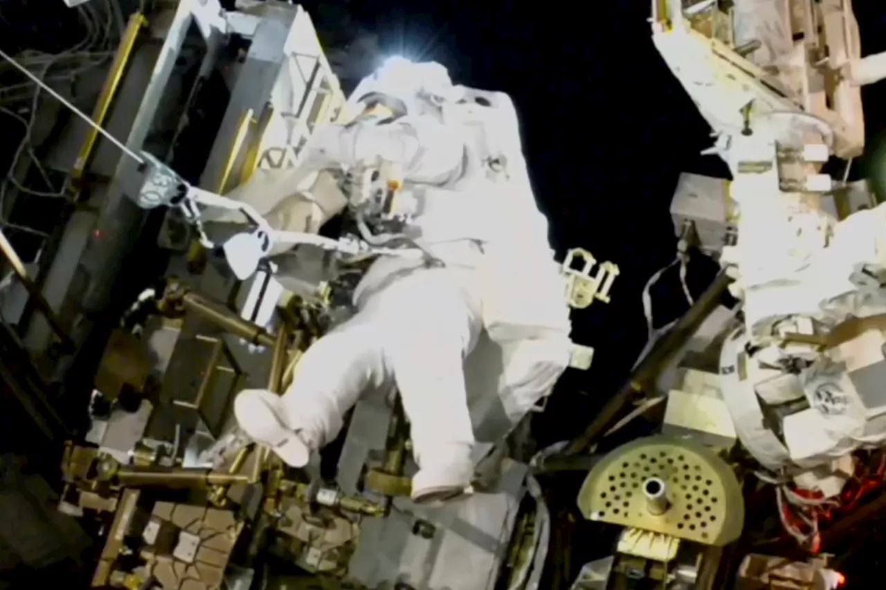 NASA's stuck astronaut steps out on spacewalk after 7 months in orbit