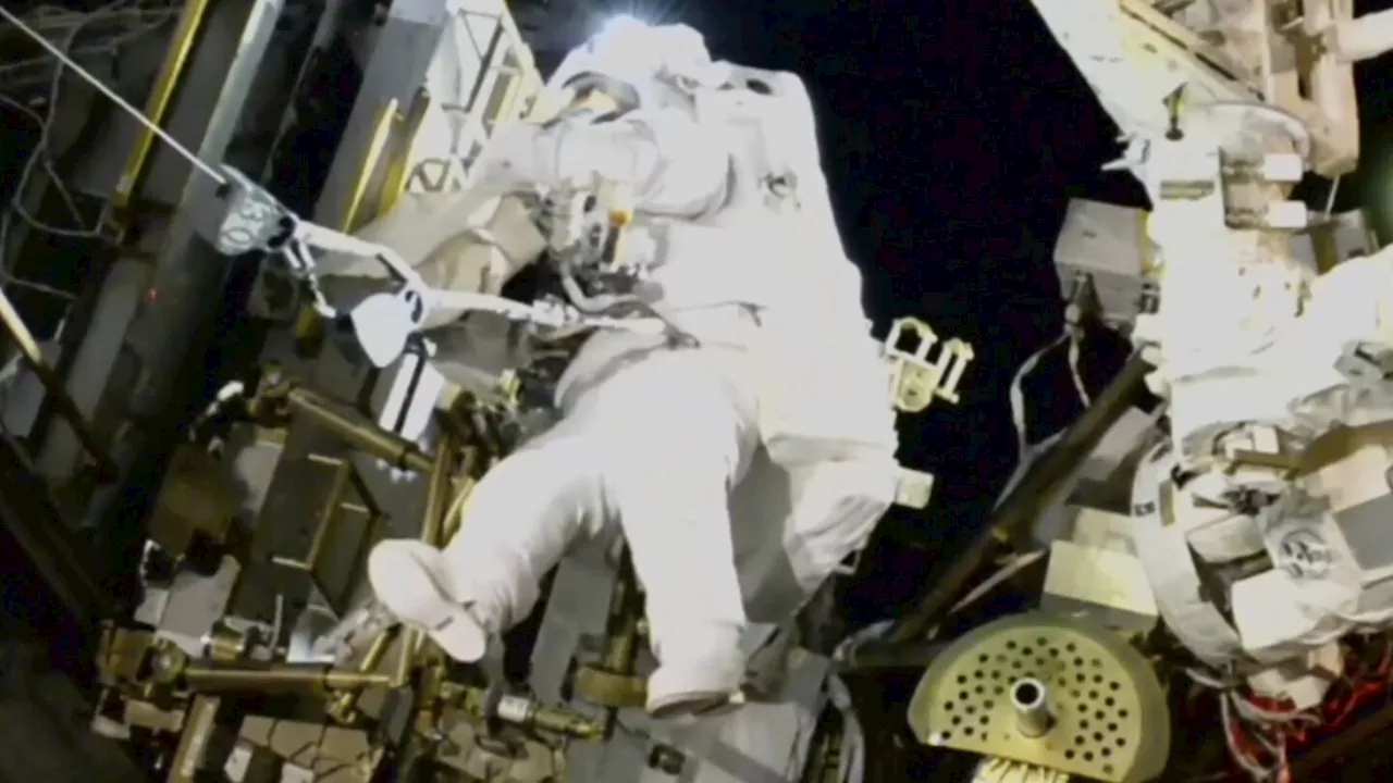 NASA's stuck astronaut steps out on a spacewalk after 7 months in orbit