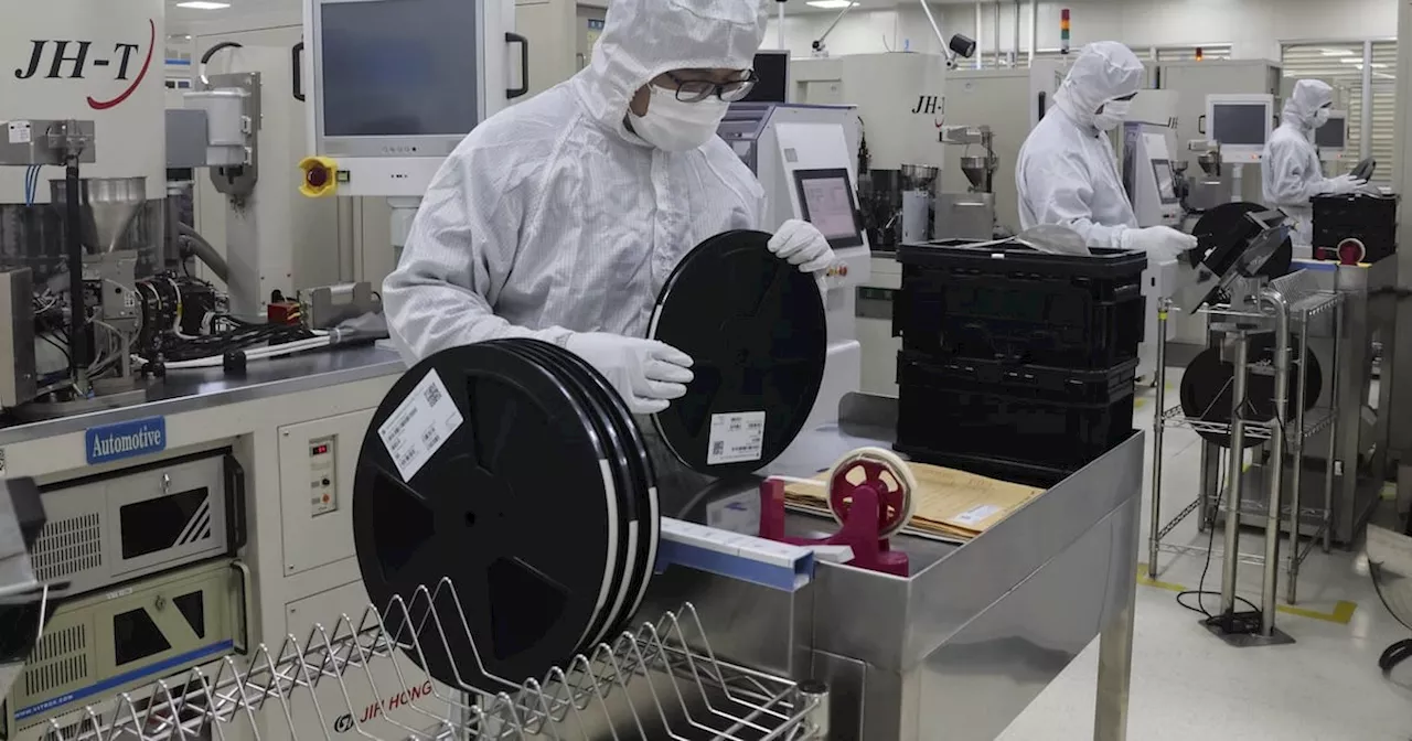 Workers Inspect Items at a Chip Maker in China