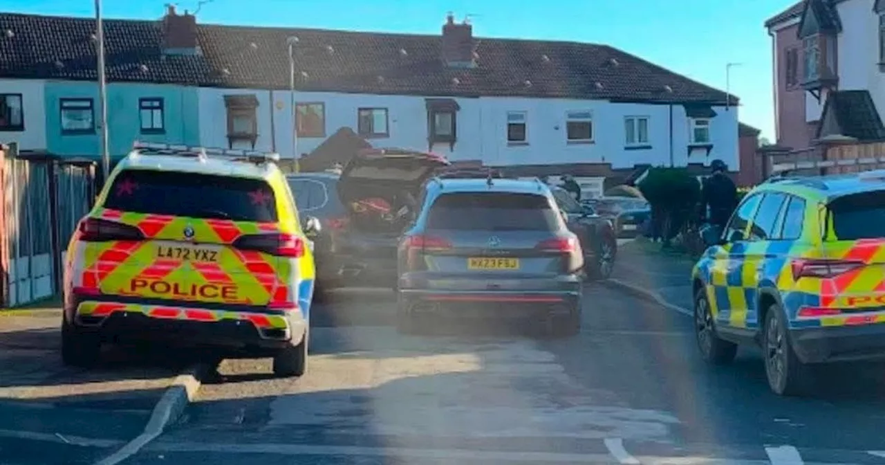 Moment armed police swarm street after man blasted in Oldham shooting