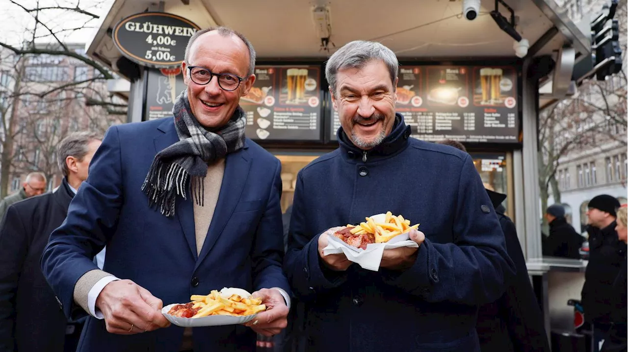 Merz und Söder genießen Currywurst-Dinner