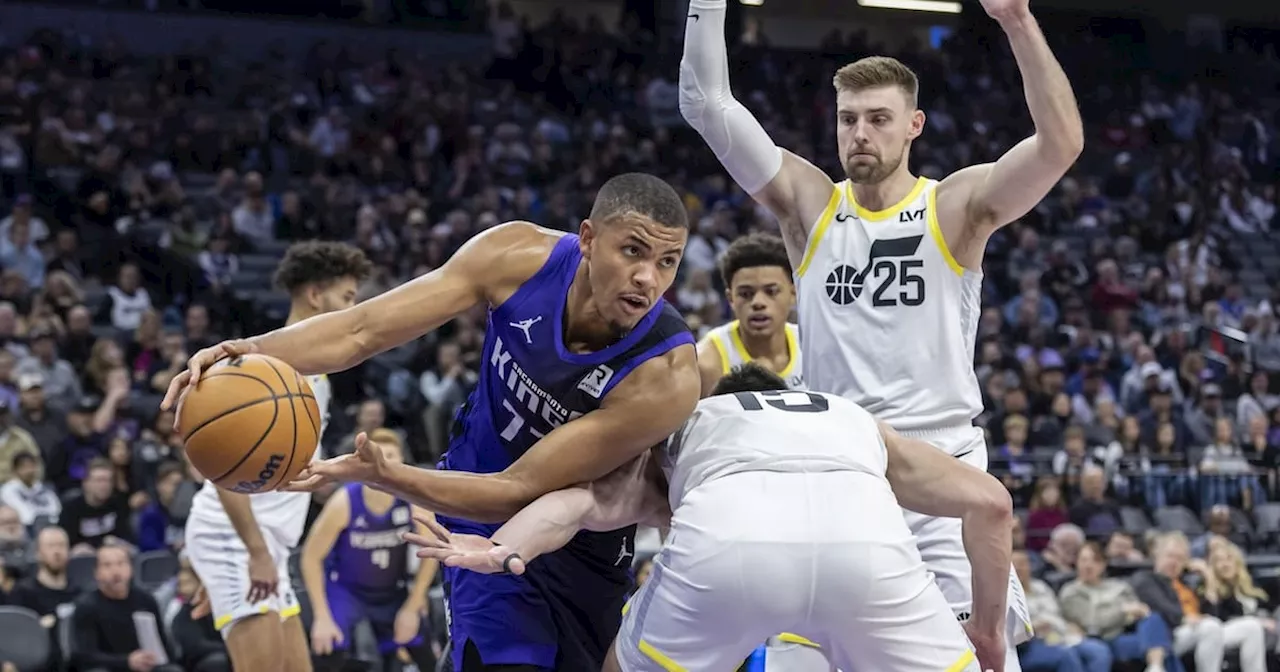 Sacramento Kings' Robinson Faces Off Against Utah Jazz's Eubanks