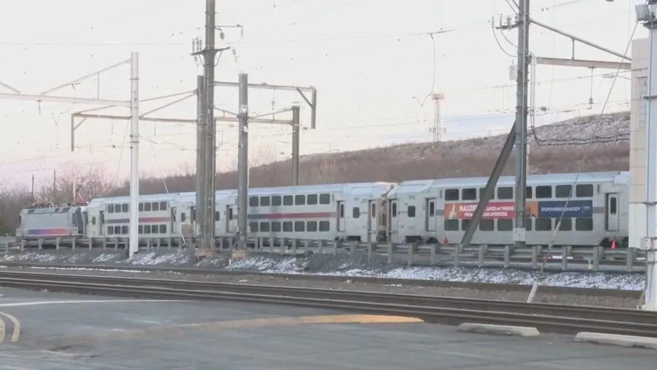 Dramatic rescue on train tracks as injured man found atop double-decker train