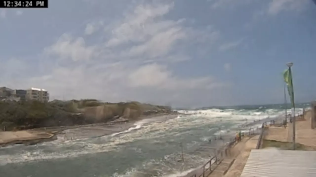 Severe storms cut power for thousands of Australians, trigger flood warnings across New South Wales