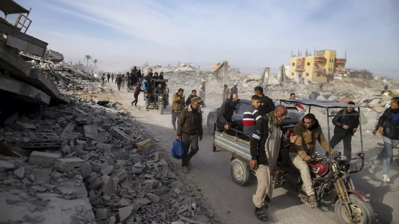 Palestinians trek across rubble to return to their homes as Gaza ceasefire takes hold