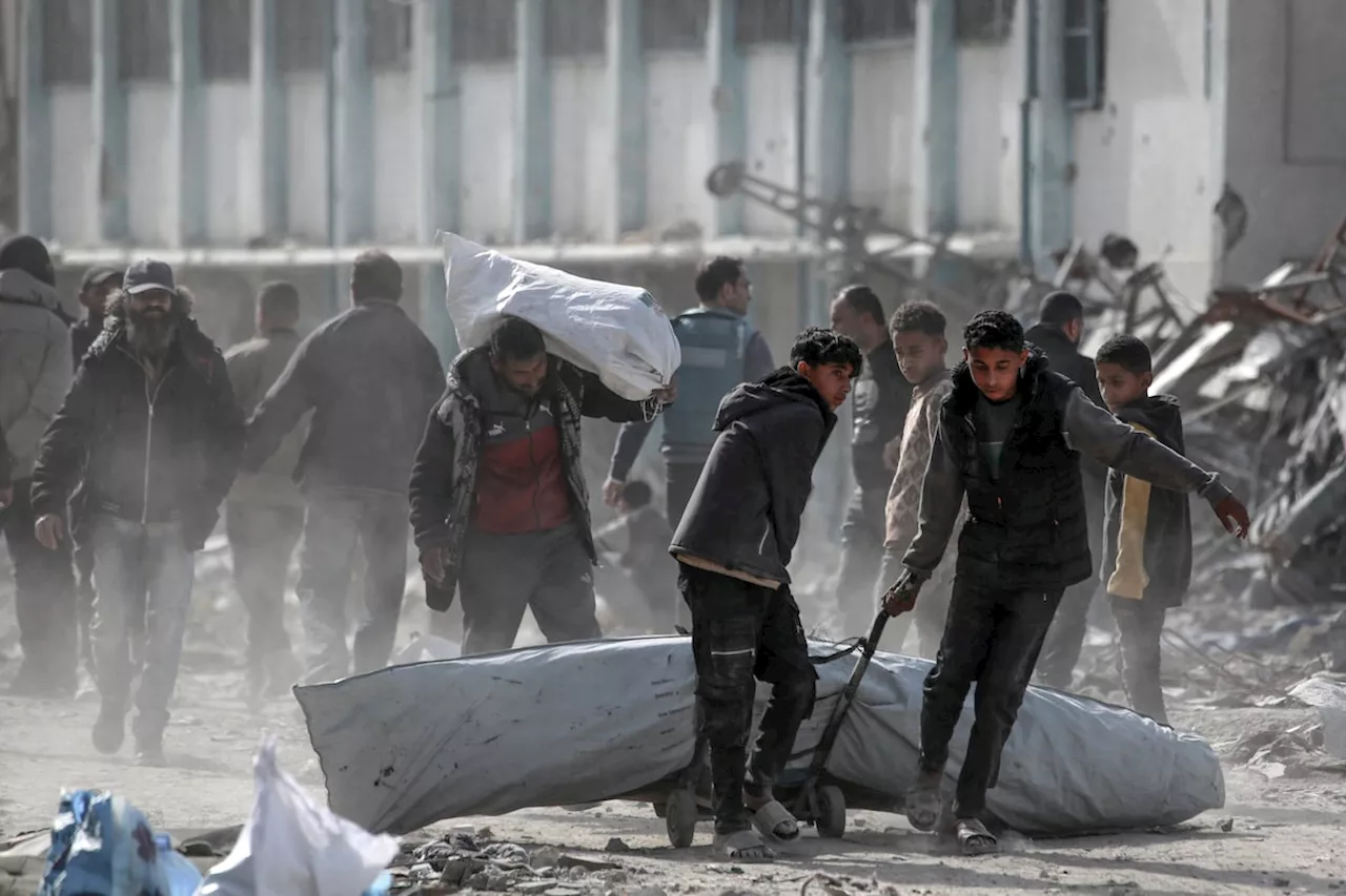 Palestinians trek across rubble to return to their homes as Gaza ceasefire takes hold