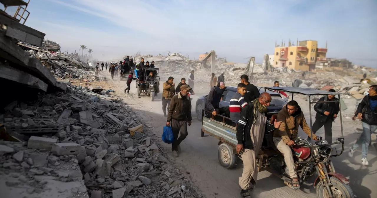 Palestinians Trek Across Rubble To Return Home As Gaza Ceasefire Begins