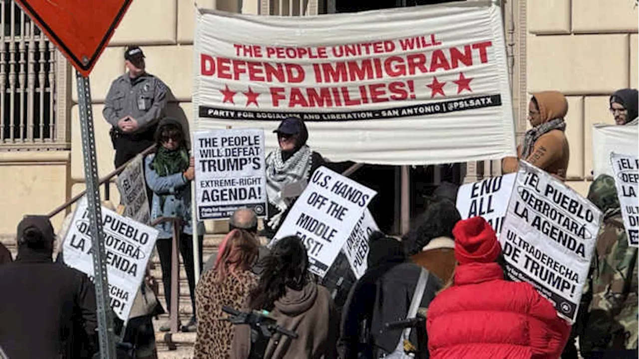 Activists rally downtown to protest against President-elect Donald Trump