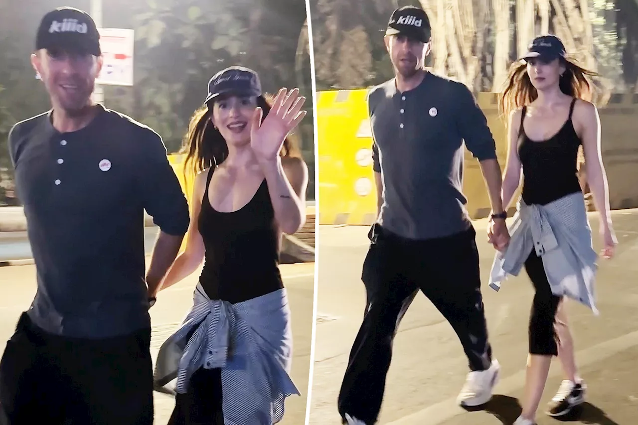 Dakota Johnson, Chris Martin hold hands in India on rare public outing five months after shutting down split rumors