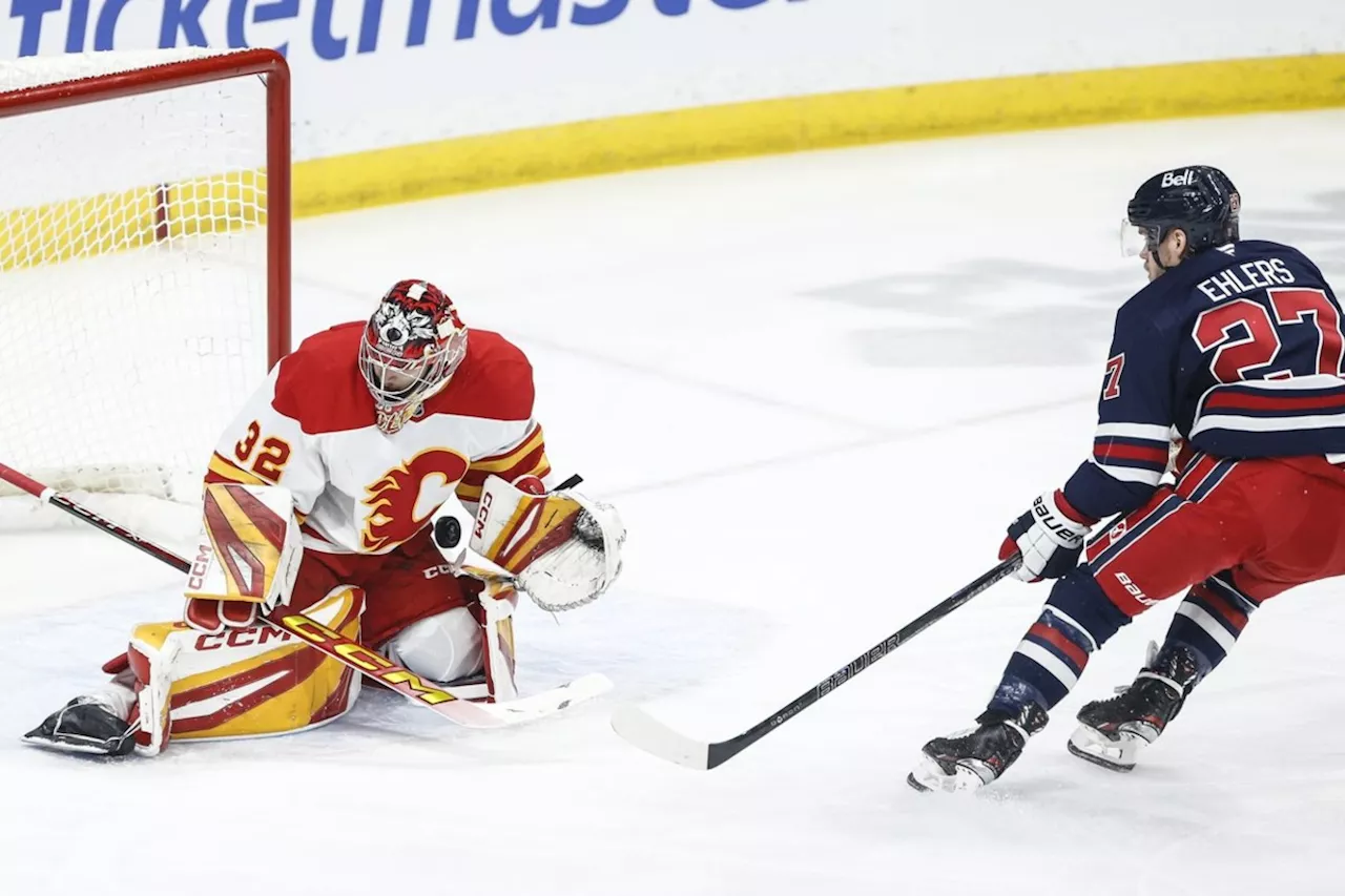 Wolf, Coleman lead Flames past Jets 3-1