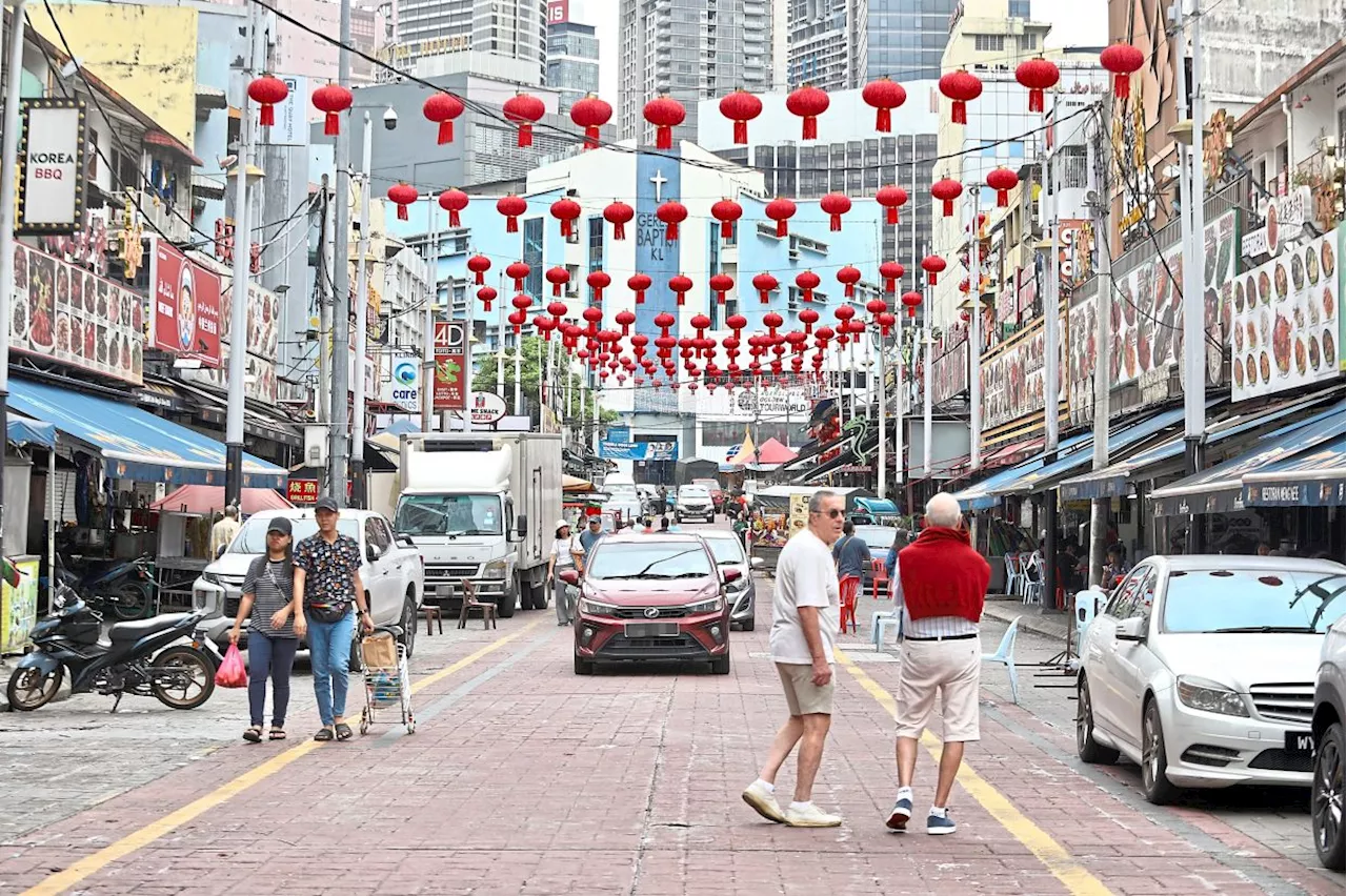 Diverging paths of two car-free roads in KL