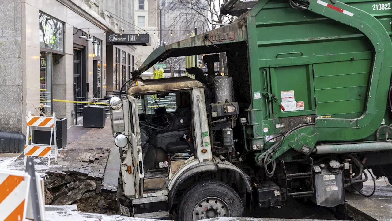 Downtown Omaha loses power for hours after a garbage truck gets stuck in a sinkhole