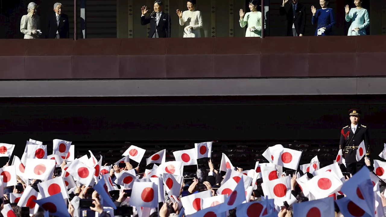 Japanese emperor and his family greet flag-waving crowd at the palace for New Year's