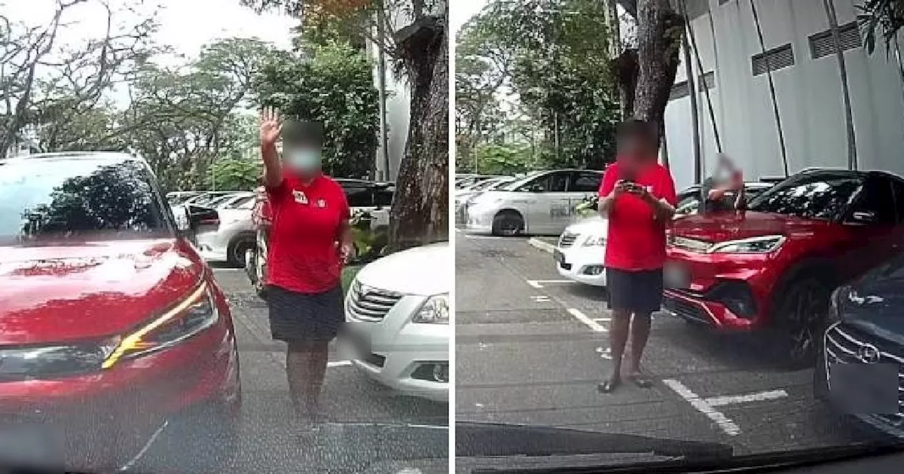 Woman Blocks Car From Reversing to Save Parking Spot in Singapore