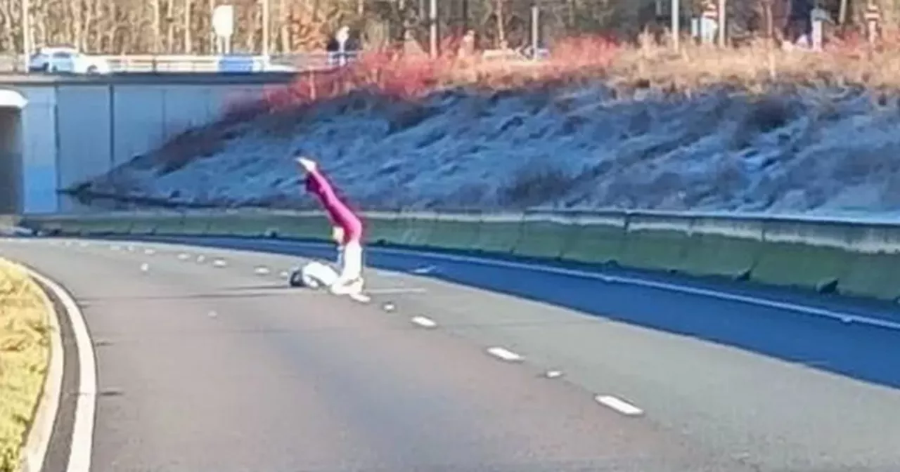 Woman Does Yoga in Flooded Motorway