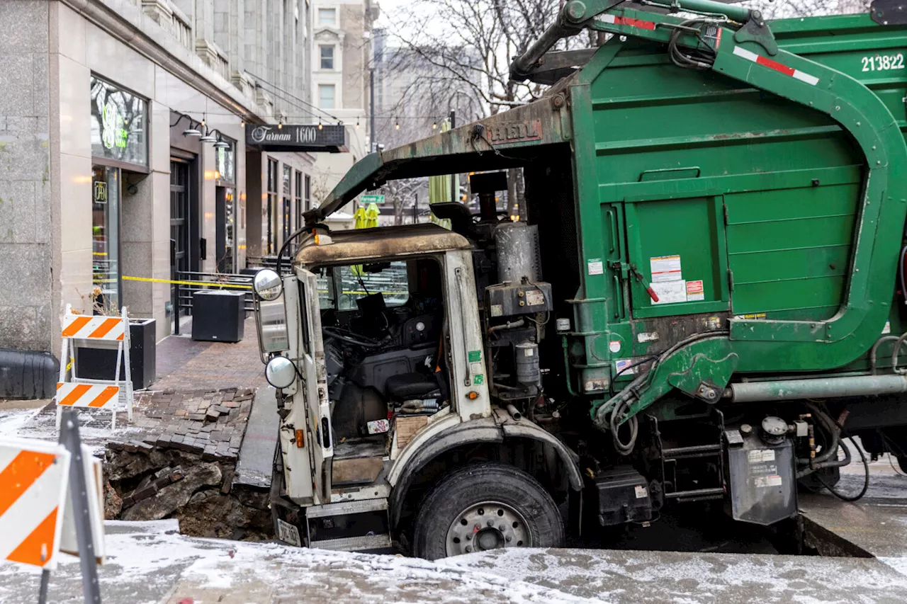 Garbage Truck Stuck in Sinkhole Disrupts Power to Downtown Omaha