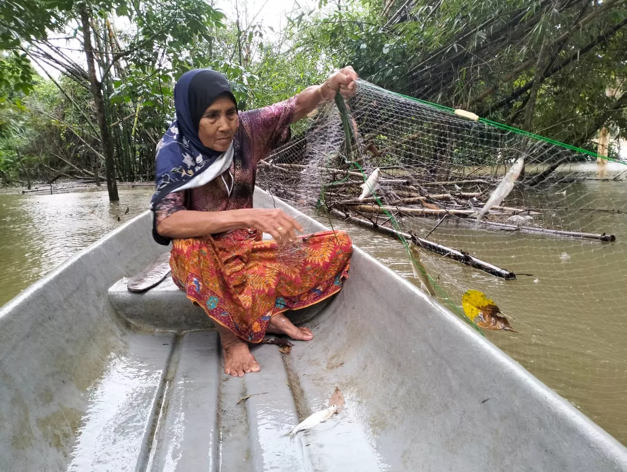 Monsoon Floodwaters Bring Fortune to Senior Fisherman