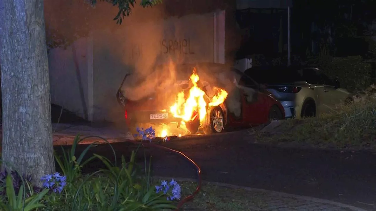 Woman charged over torched car and anti-Semitic graffiti in Sydney