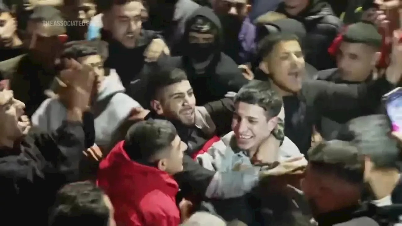 First group of freed Palestinian prisoners arrives in West Bank amid cheering crowds