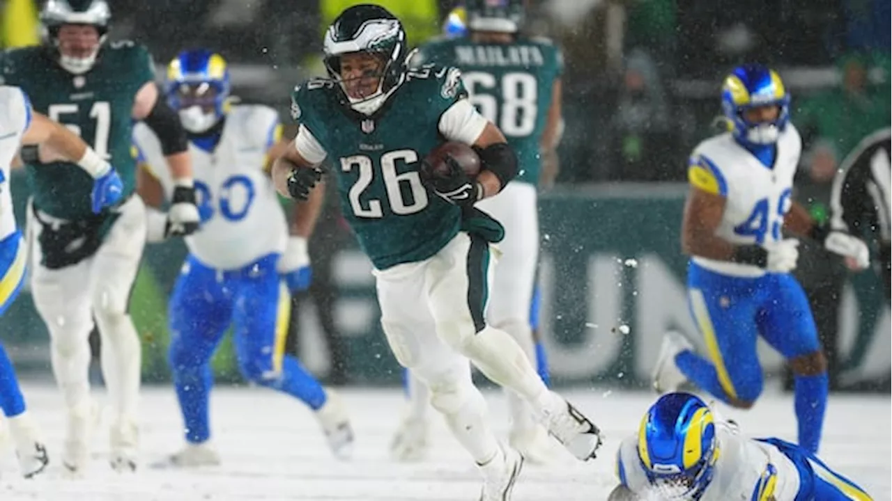 Barkley romps through snow, Rams for 2 TDs as Eagles advance to NFC championship