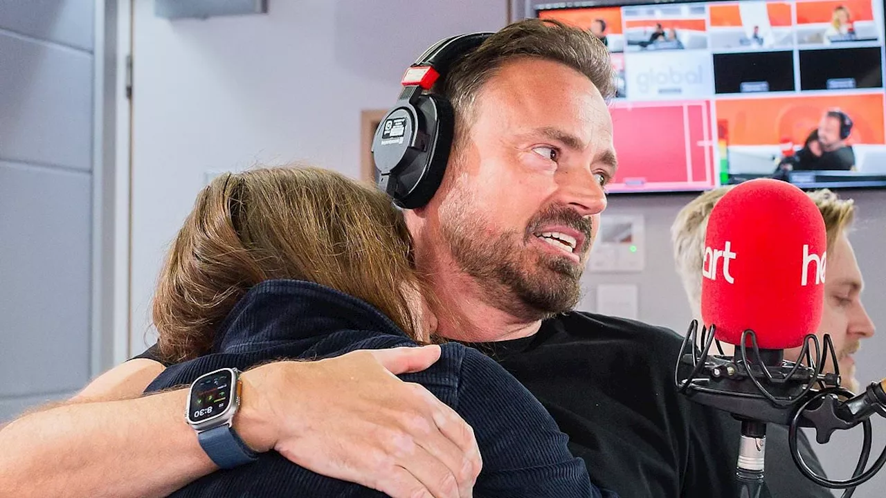 The emotional moment Jamie Theakston, 54, hugs pals Davina McCall and Amanda Holden as he returns to...