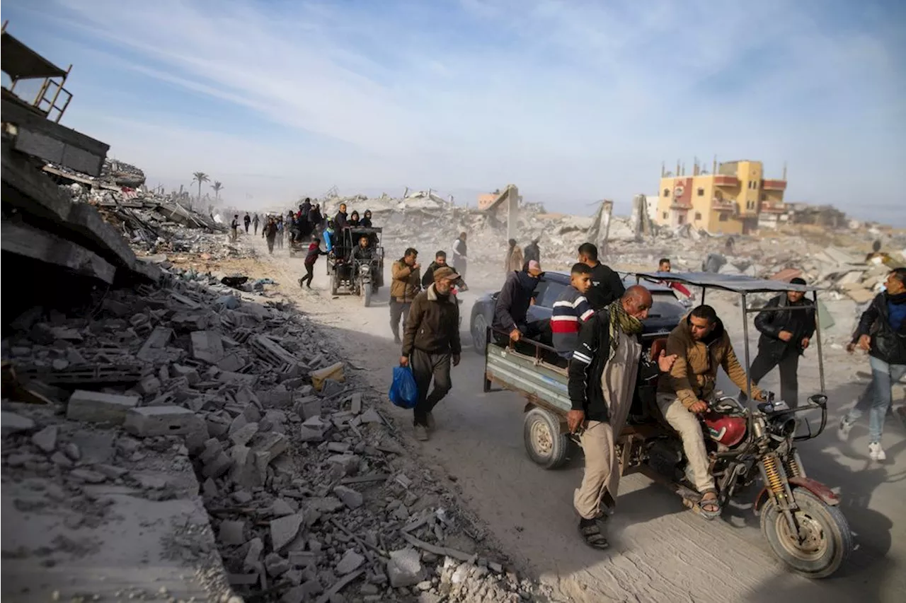 Palestinians trek across rubble to return to their homes as Gaza ceasefire takes hold