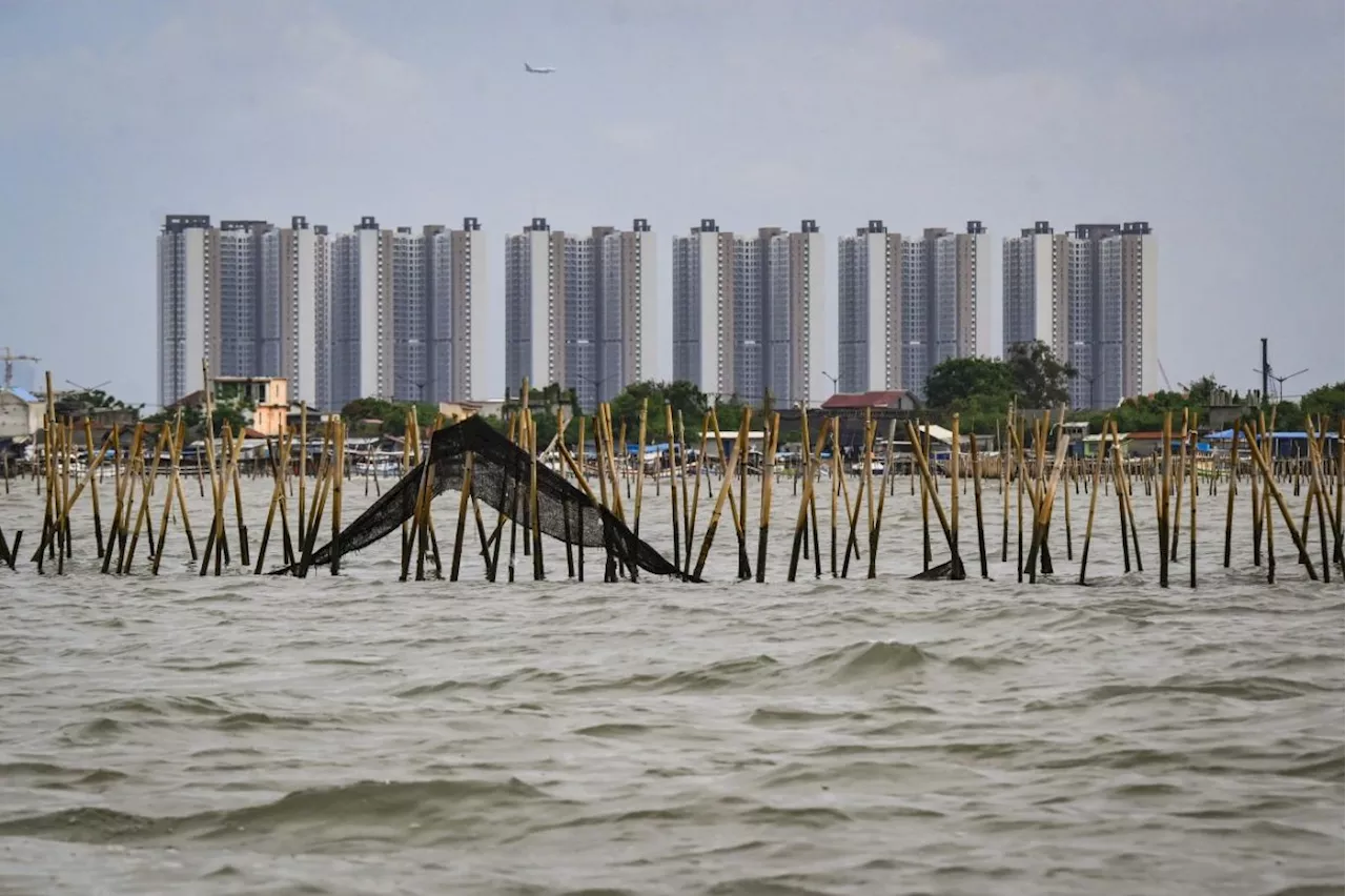 Indonesian navy taking down ‘mysterious’ sea fence that sparked reclamation debate