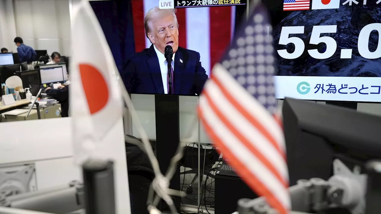 Stock market today: Asian shares trade mixed in a muted reaction to the U.S. inauguration